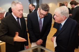 Frank Villella, archivist for the Chicago Symphony Orchestra, describes the Strauss manuscript to Matthew VanBesien, president of the New York Philharmonic, and William Josephson